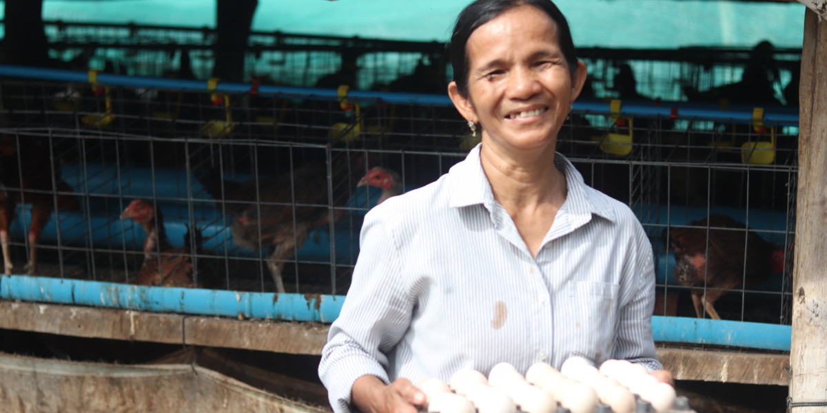 Mrs. Oeung Kanh and her chicken eggs