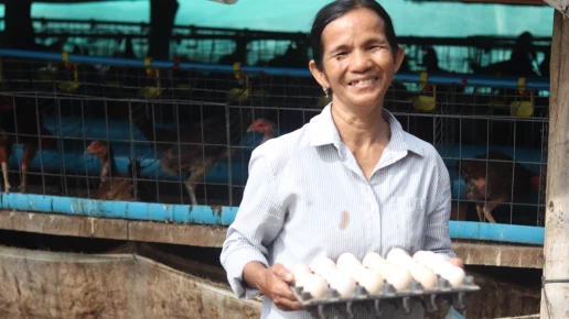 Mrs. Oeung Kanh and her chicken eggs